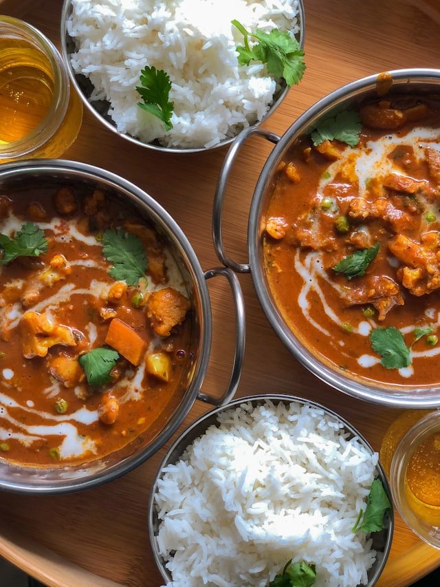 Indian curry bowls with rice at Spice Garden
